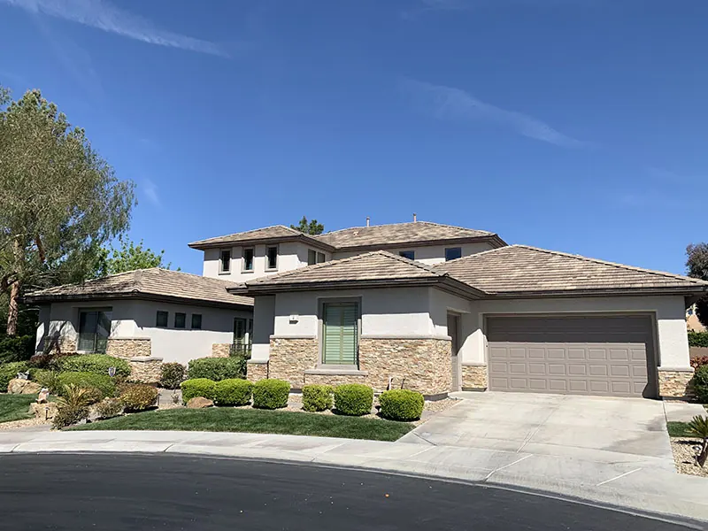 Finished two-tone home with stone accents on a clean corner lot